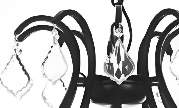 Black leather harness with silver hardware on a white background