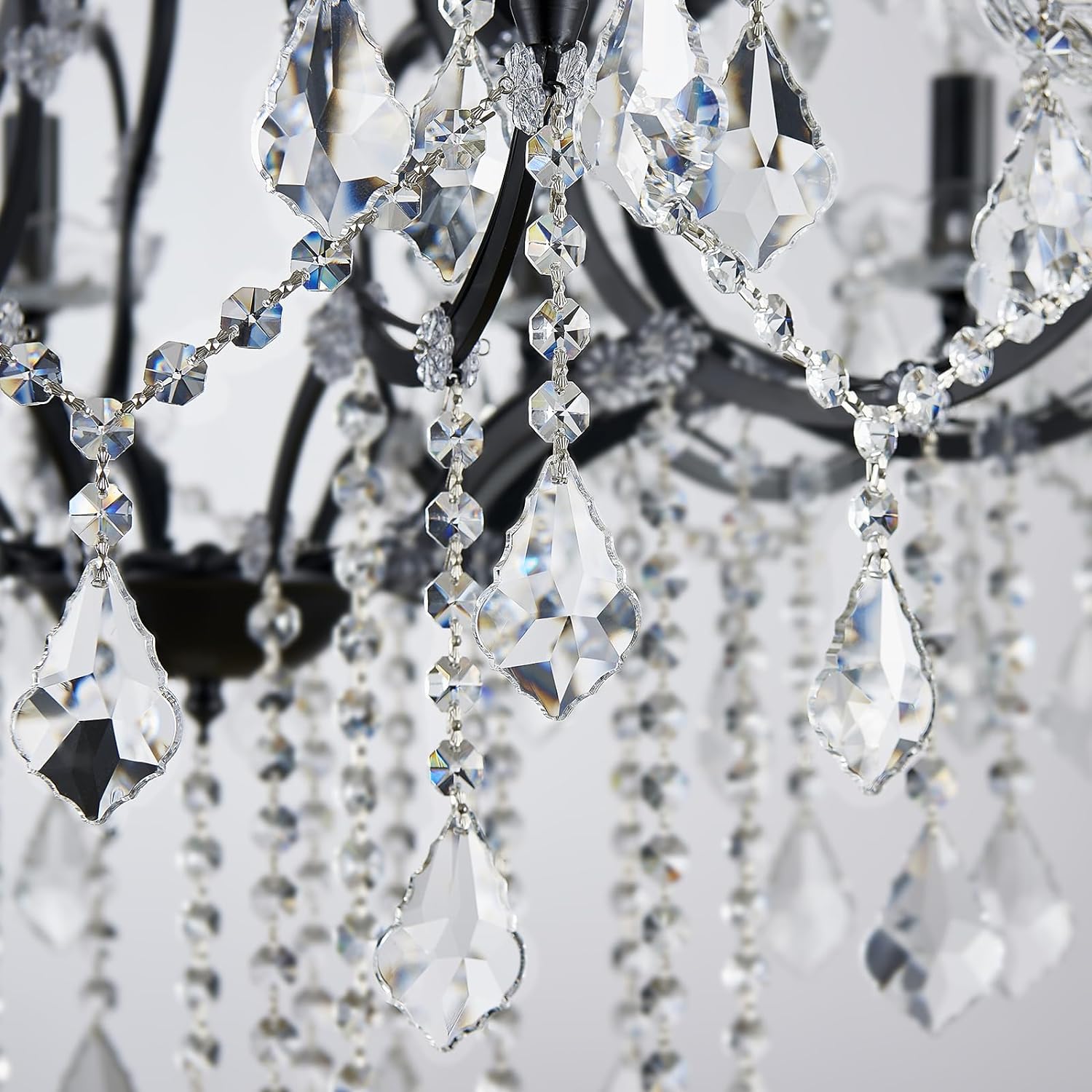 Close-up of a chandelier with crystal prisms and beads.